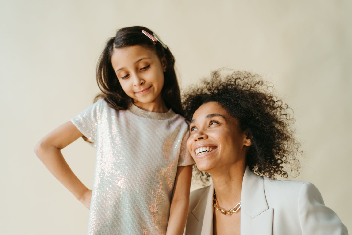 A mother and daughter smiling together